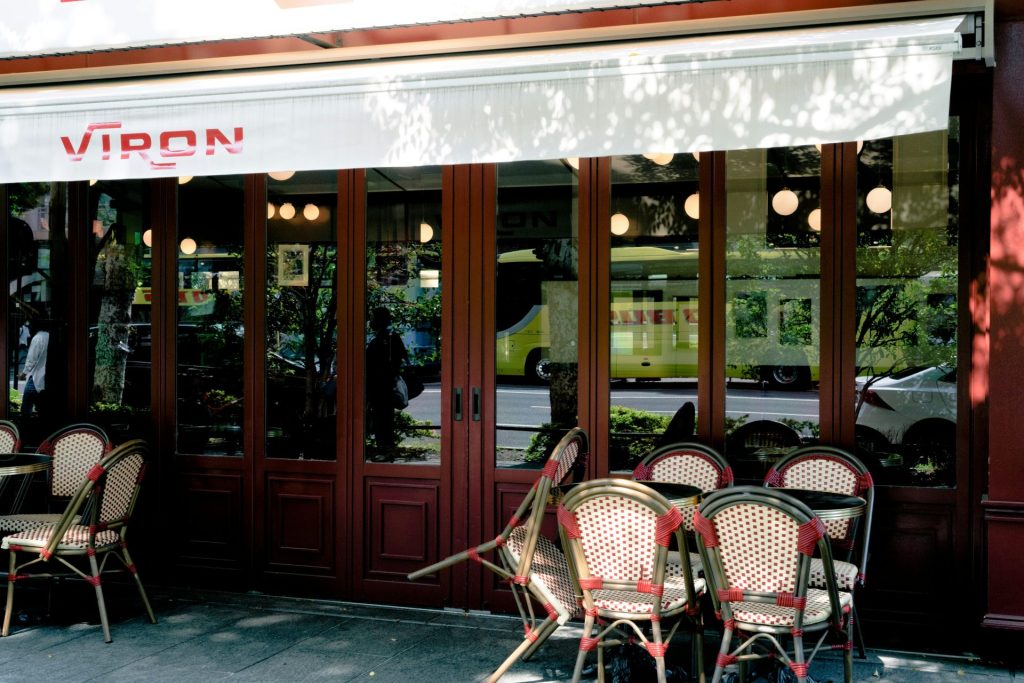 a restaurant with tables and chairs outside